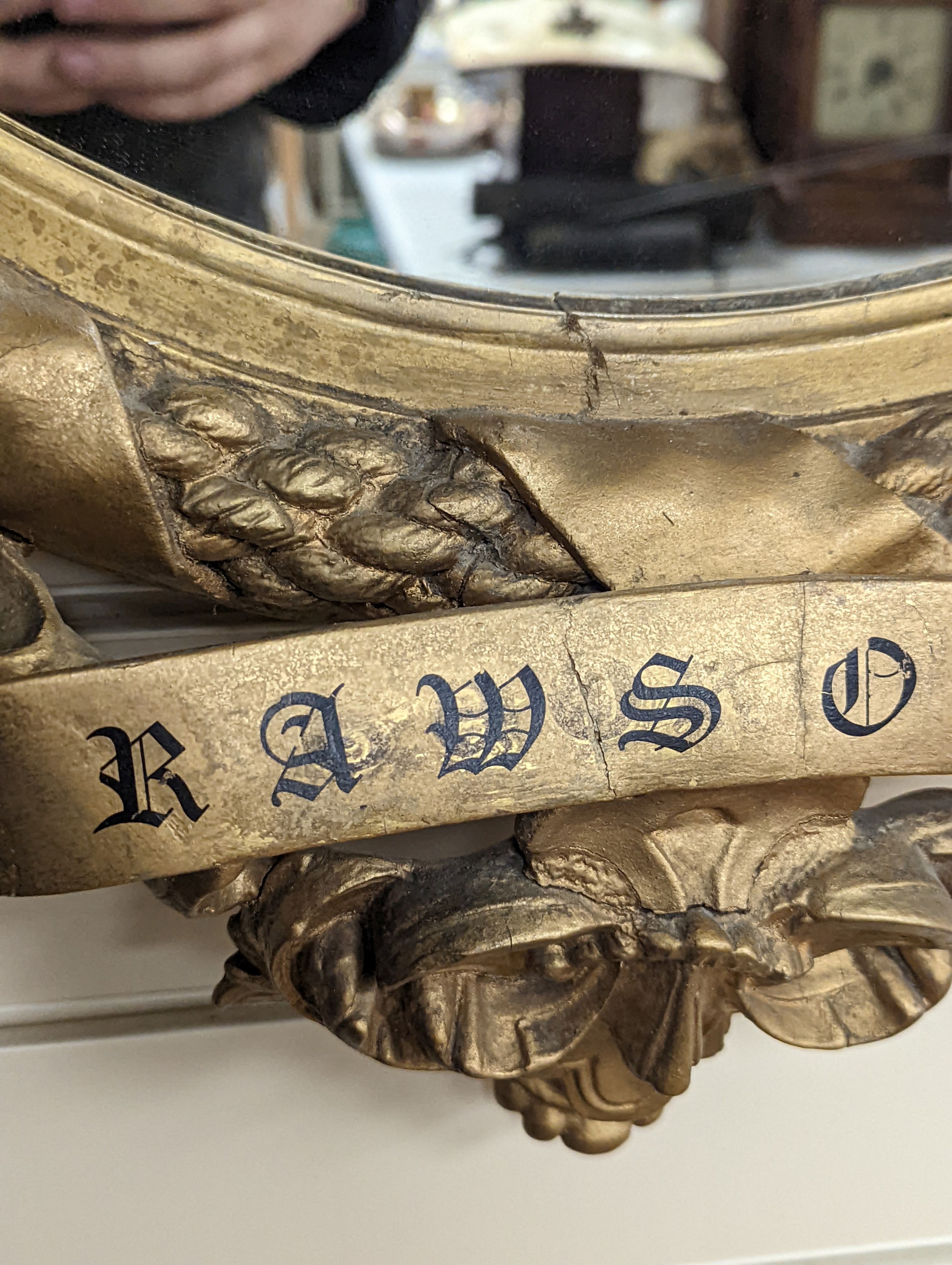 A Victorian gilt and composite mirror,, 99 cms high.